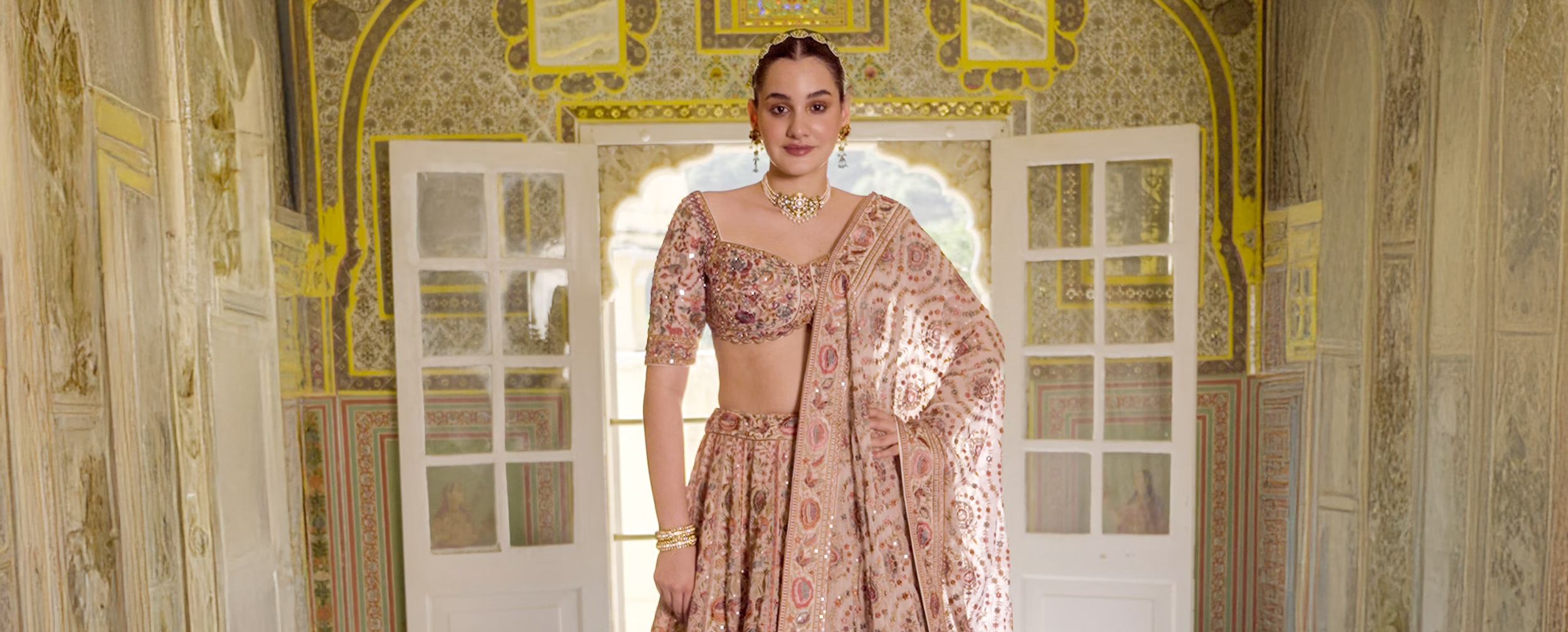Bride dressed in beautiful pink bridal lehenga for wedding ceremony