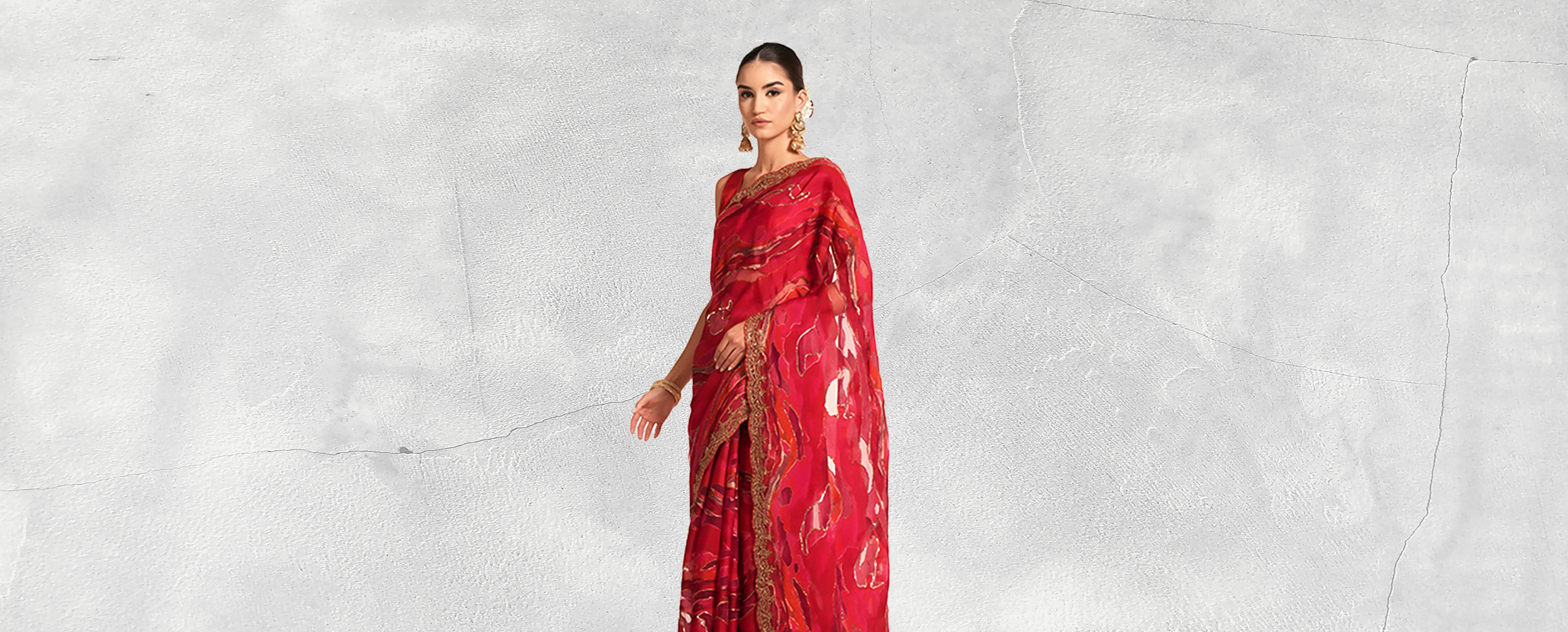  A beautiful woman in a red sequin saree
