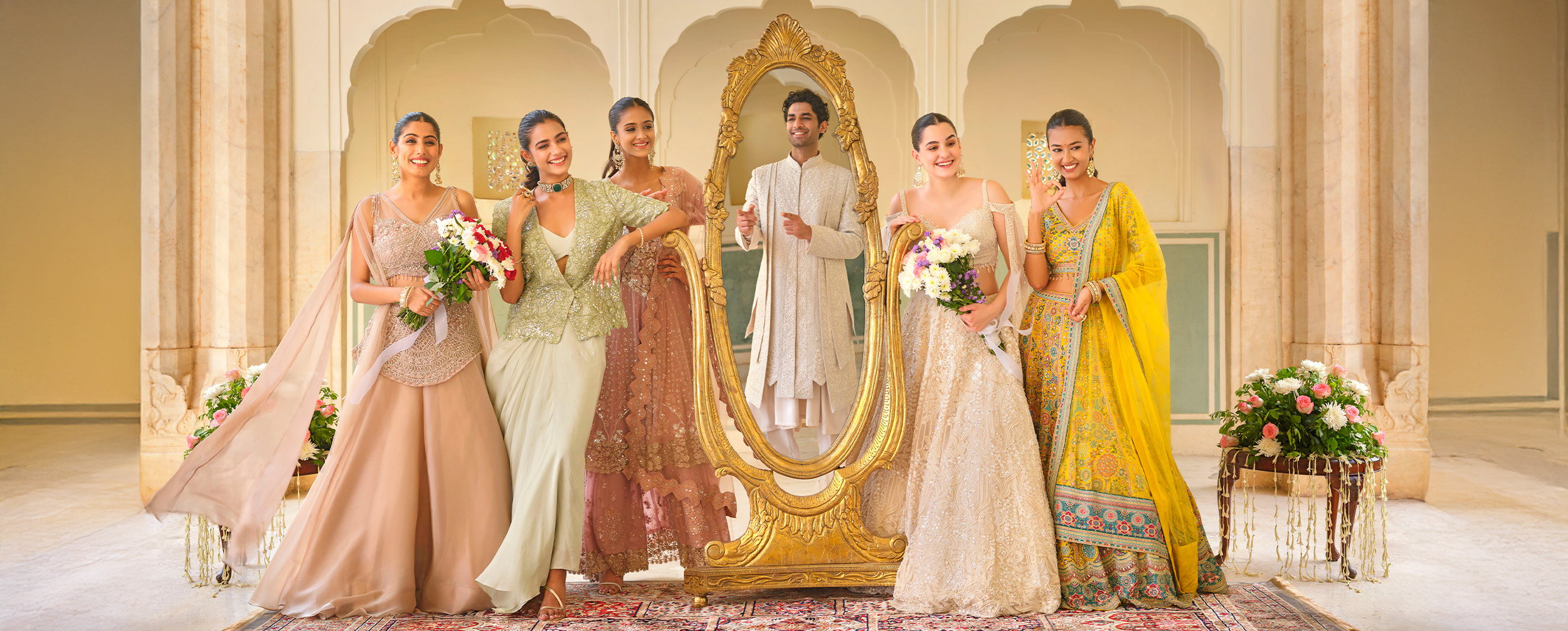 Womens iwearing colourfull sarees and lehengas for wedding ceremony